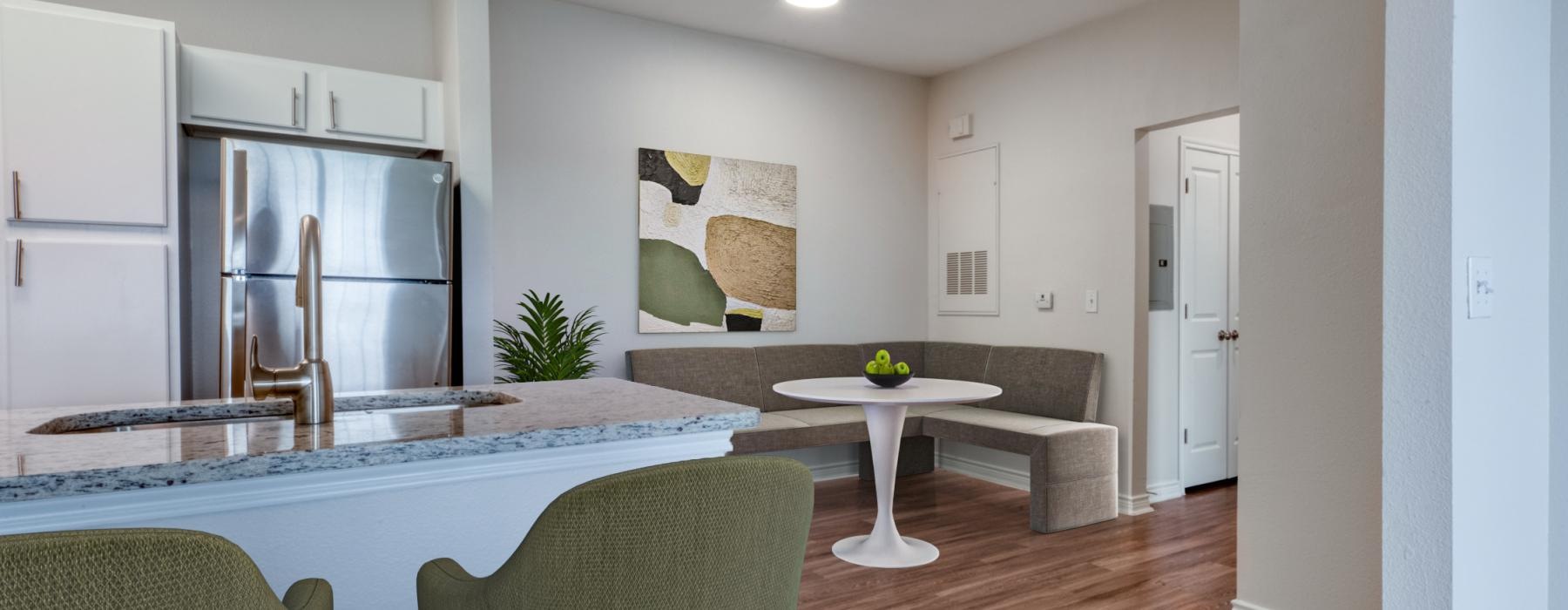 a living room with a table and chairs