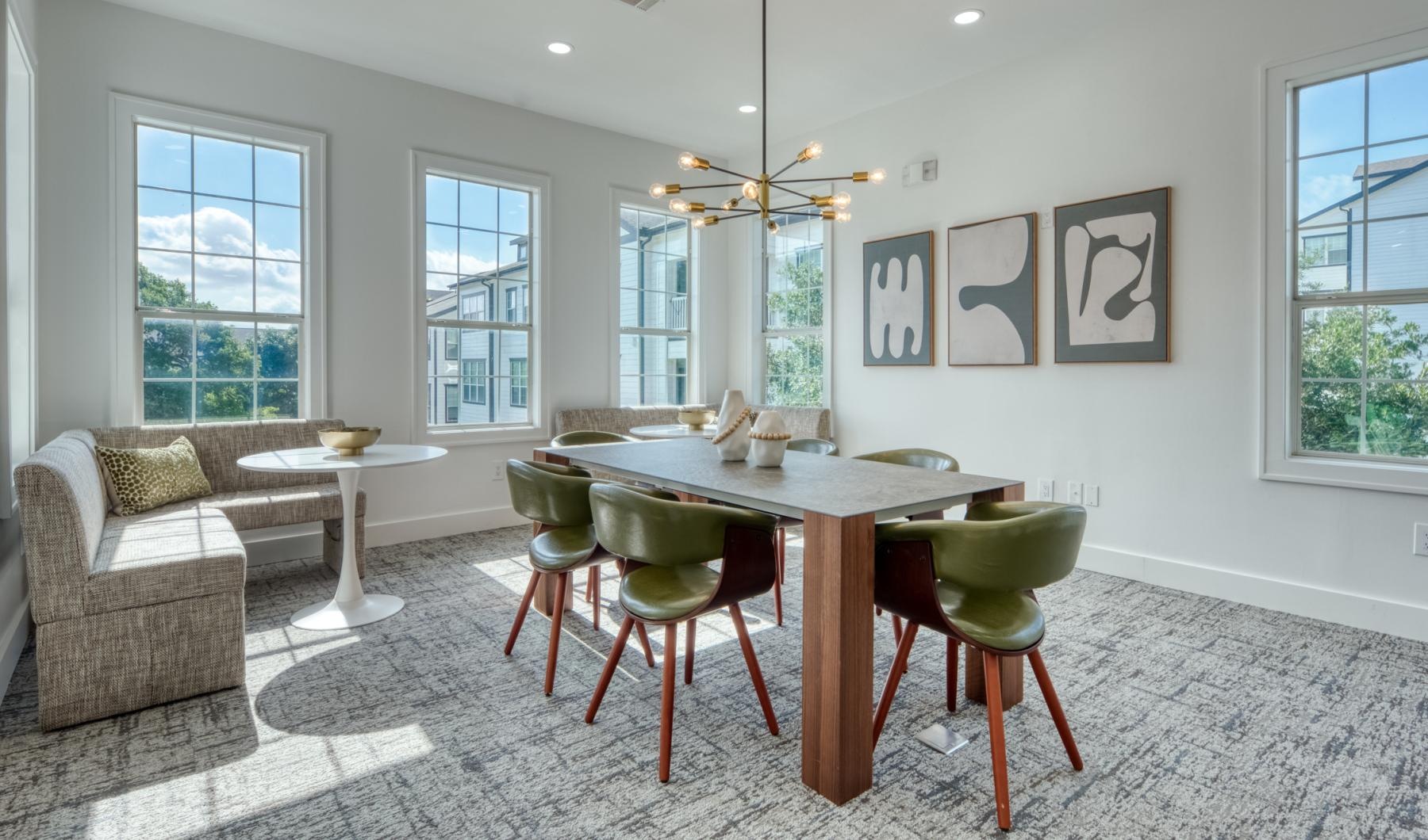 a dining room with a chandelier and a table